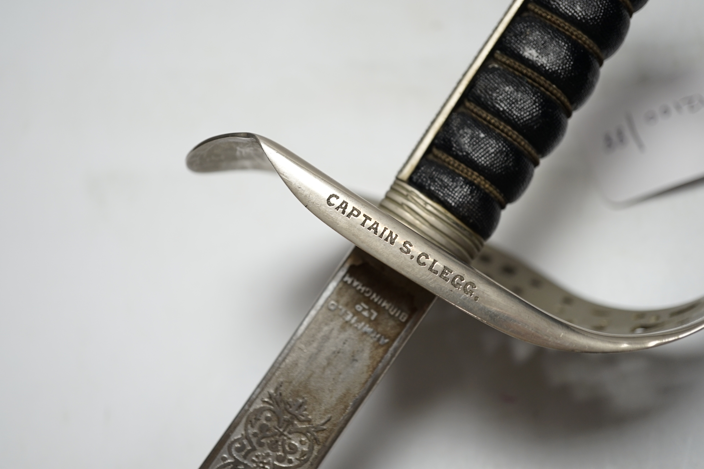 A George V officer's sword, manufactured by Armfield Ltd and engraved ‘Captain S.Clegg’ to hilt, with scabbard